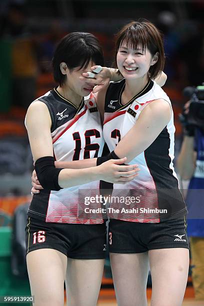 Saori Sakoda of Japan is consoled by Saori Kimura after the Women's Quarterfinal match between Japan and The United States on day 11 of the Rio 2106...