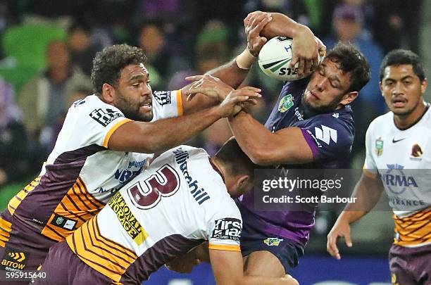 Will Chambers of the Storm is tackled by Tom Opacic of the Broncos during the round 25 NRL match between the Melbourne Storm and the Brisbane Broncos...