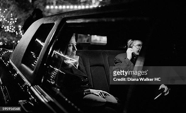 First Lady Hillary Clinton heads into New York City with her chief of staff, Melanne Verveer, after viewing the holiday lights at the Bronx Zoo on...