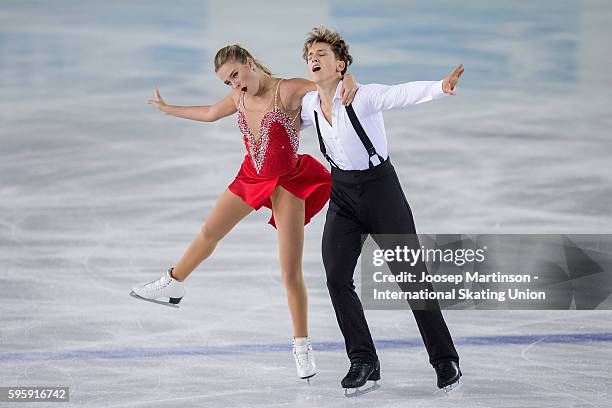 Christina Carreira and Anthony Ponomarenko of the United States compete during the ice dance short dance on day two of the ISU Junior Grand Prix of...