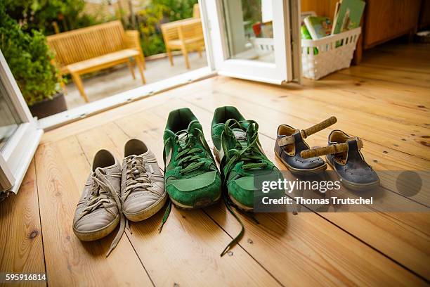 Berlin, Germany Staged Photo: The shoes of a young family are standing in their house on August 12, 2016 in Berlin, Germany.