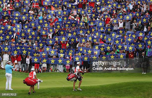 Crowds hold up Go Europe placards for the European Ryder Cup Team Captain Darren Clarke on the 16th green during the second round of Made in Denmark...