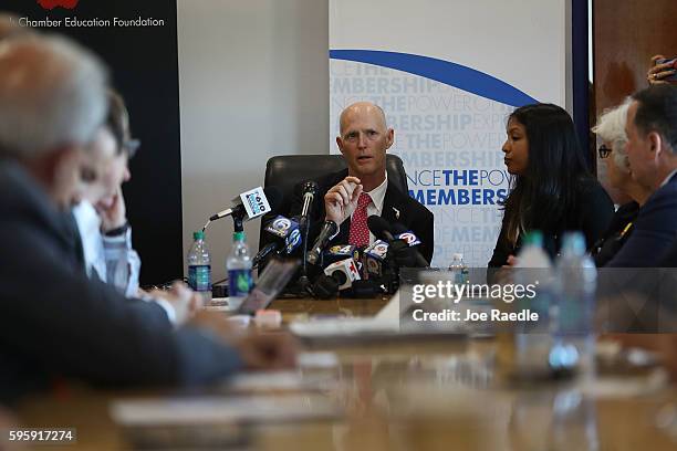 Florida Governor Rick Scott attends a round table discussion about Zika preparedness in the Miami Beach neighborhood where the mosquito born Zika...