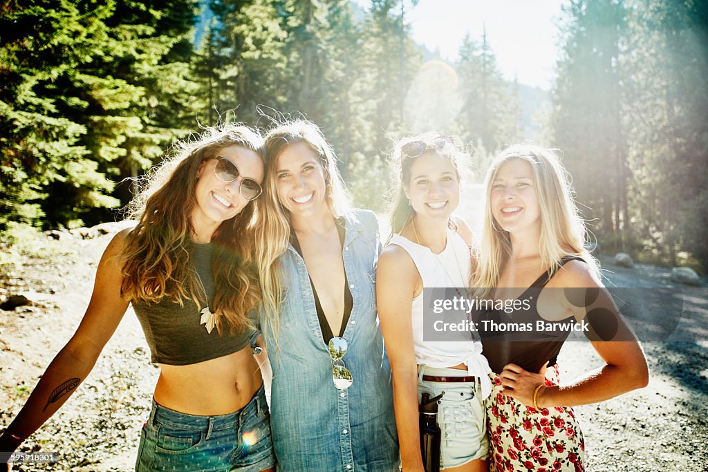 Smiling female friends on summer road trip