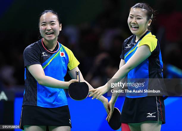 Ai Fukuhara and Mima Ito of Japan celebrate their win over Li Qiangbing and Sofia Polcanova of Austria in the Table Tennis Women's Team Round...