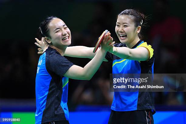 Ai Fukuhara and Mima Ito of Japan celebrate their win over Li Qiangbing and Sofia Polcanova of Austria in the Table Tennis Women's Team Round...
