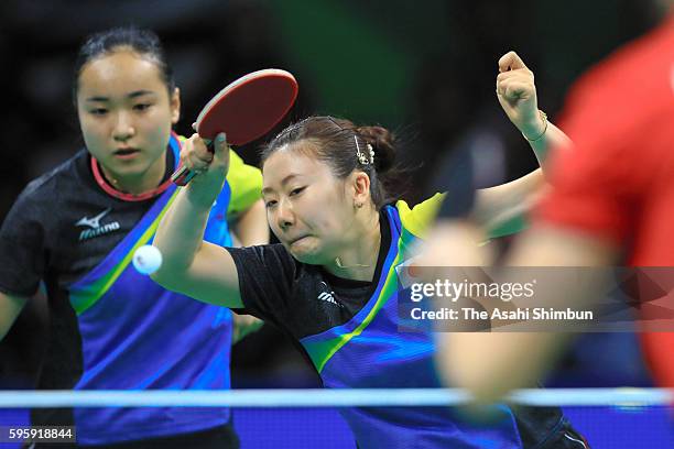 Ai Fukuhara and Mima Ito of Japan compete against Li Qiangbing and Sofia Polcanova of Austria in the Table Tennis Women's Team Round Quarterfinal...