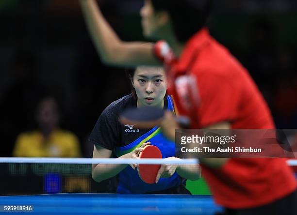 Kasumi Ishikawa of Japan competes against Liu Jia of Austria during the Table Tennis Women's Team Round Quarterfinal between Japan and Austria during...