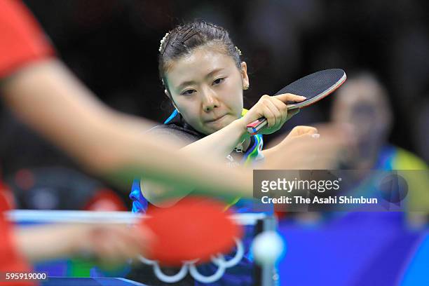 Ai Fukuhara of Japan competes against Sofia Polcanova of Austria in the Table Tennis Women's Team Round Quarterfinal between Japan and Austria during...