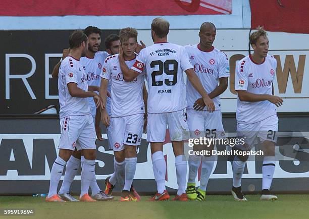 Patrick Weihrauch of Wuerzburg celebrates his team's first goal with team mates during the Second Bundesliga match between 1. FC Heidenheim 1846 and...