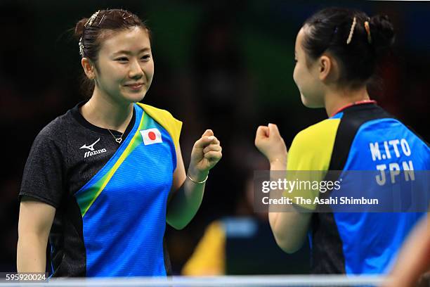 Ai Fukuhara and Mima Ito of Japan celebrate their win over Li Qiangbing and Sofia Polcanova of Austria in the Table Tennis Women's Team Round...