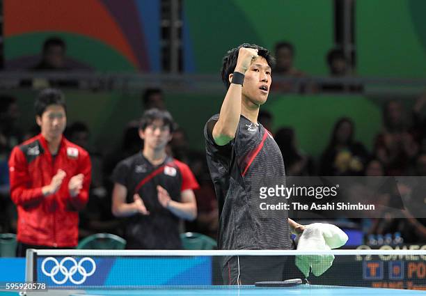 Jun Mizutani of Japan celebrates a point against Jakub Dyjas of Poland in the Table Tennis Men's Team Round One Match between Japan and Poland during...