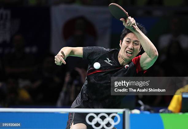 Jun Mizutani of Japan competes against Jakub Dyjas of Poland in the Table Tennis Men's Team Round One Match between Japan and Poland during Day 8 of...