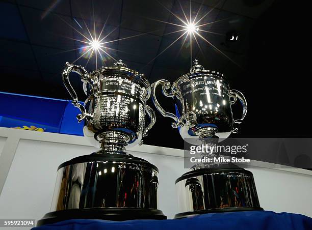 The Women's Singles and Men's Singles trophies are seen during the Draw Ceremony prior to the start of the 2016 US Open at the USTA Billie Jean King...