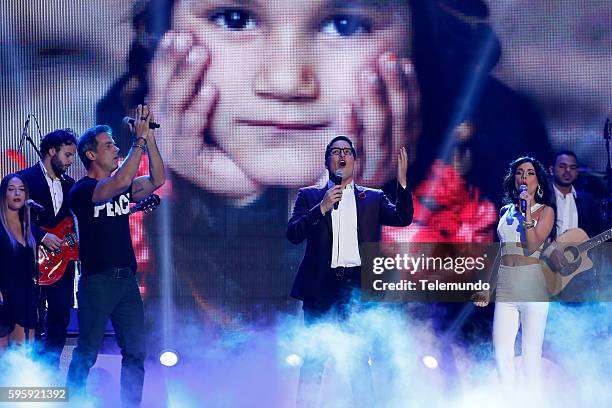 Show" -- Pictured: Carlos Ponce, Raul Gonzalez, and Carolina Gaitan perform on stage during the 2016 Premios Tu Mundo at the American Airlines Arena...