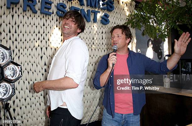 Alex James and Jamie Oliver playing songs at the Cheese Hub on the first day of The Big Feastival at Alex James' Farm on August 26, 2016 in Kingham,...