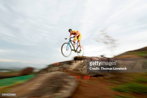 Summer Olympics: Blur view of Spain Carlos Coloma Nicolas in action during Men's Cross-Country Final at the Mountain Bike Centre. Blur. Nicolas wins...