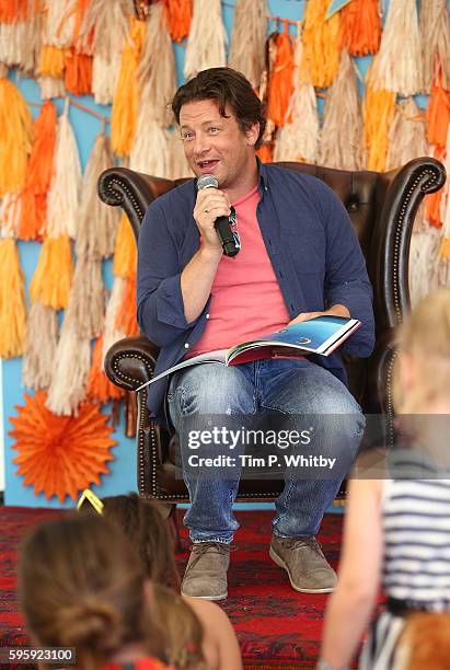 Jamie Oliver reads a story to children in the Big Top at The Big Feastival at Alex James' Farm on August 26, 2016 in Kingham, Oxfordshire.