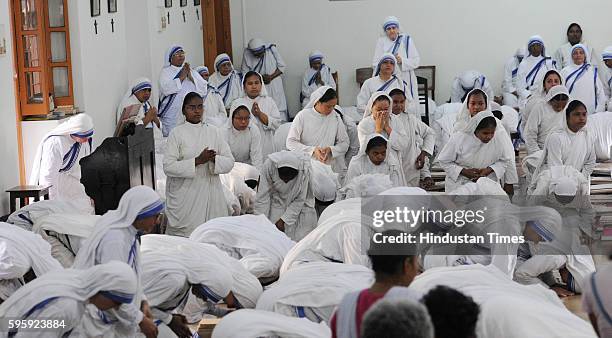 Sisters are in morning prayers on the occasion of Mother Teresa's 106th birth anniversary at Mother House on August 26, 2016 in Kolkata, India.