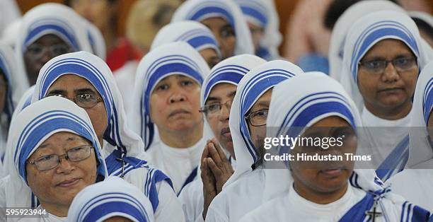 Nuns offering morning prayers on the occasion of Mother Teresa's 106th birth anniversary, near Mother's Tomb at Mother House on August 26, 2016 in...