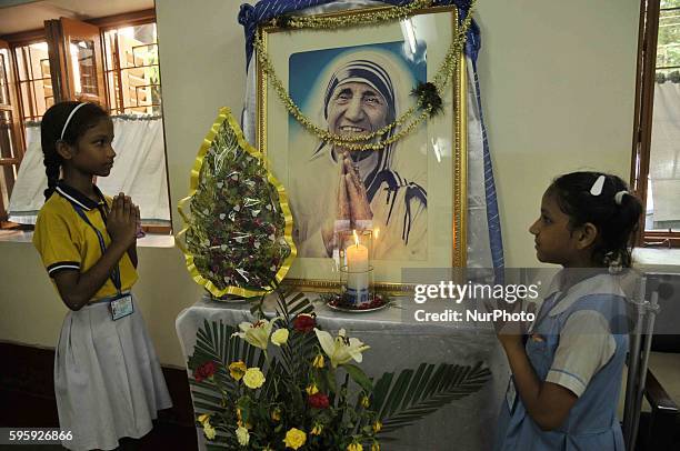 School Student Pray on front of Mother Photographs, Missionaries of Charity celebrate the 106th birthday of Mother Teresa at the Indian Missionaries...