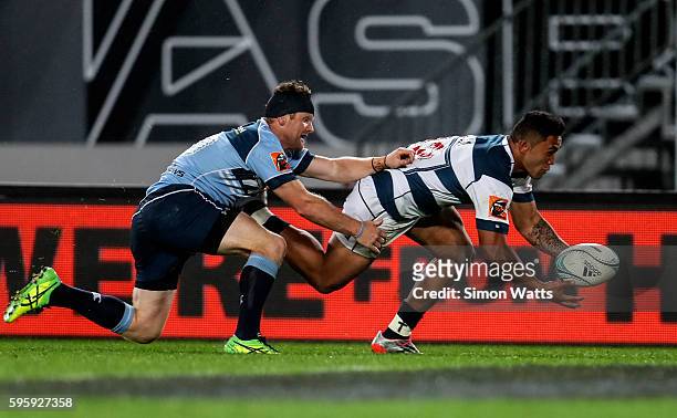 Vince Aso of Auckland scores a try as Peter Breen of Northland attempts to tackle during the round two Mitre 10 Cup match between Auckland and...