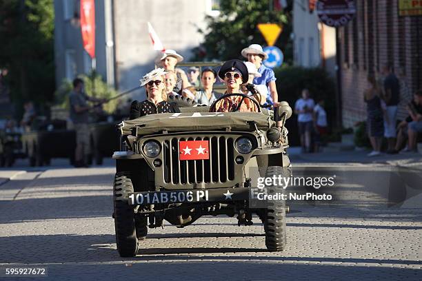 Great parade of the historic vehiclels and restorers dresed in historical uniforms at the Hel streets on 26 August 2016 the day before D-Day event....