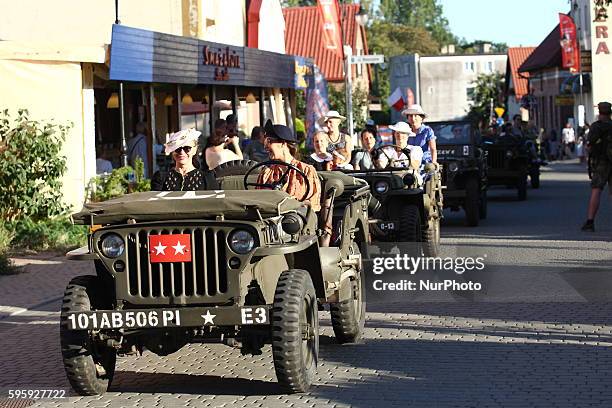 Great parade of the historic vehiclels and restorers dresed in historical uniforms at the Hel streets on 26 August 2016 the day before D-Day event....