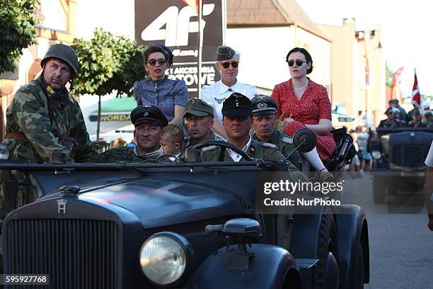 Great parade of the historic vehiclels and restorers dresed in historical uniforms at the Hel streets on 26 August 2016 the day before D-Day event....