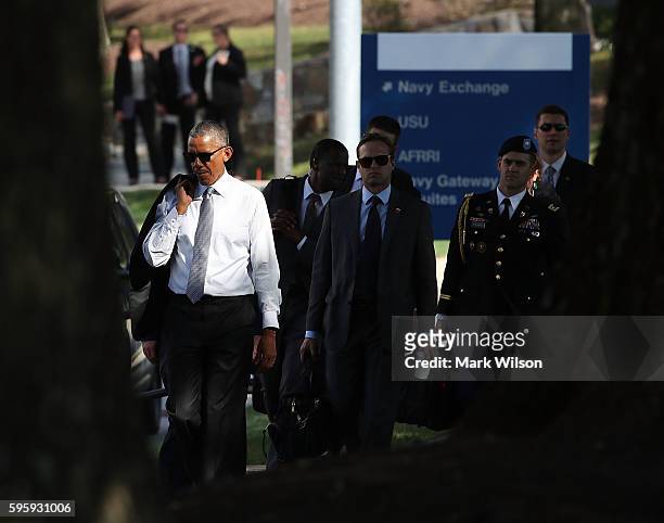 President Barack Obama walks away from Walter Reed National Medical Center August 26, 2016 in Bethesda, Marland. President Obama visited with wounded...