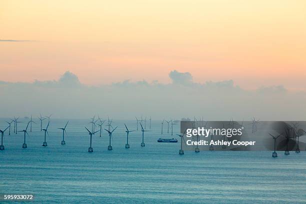 an offshore wind farm and gas platfroms in morecame bay from the summit of black combe, cumbria, uk. - oil rig uk stock pictures, royalty-free photos & images