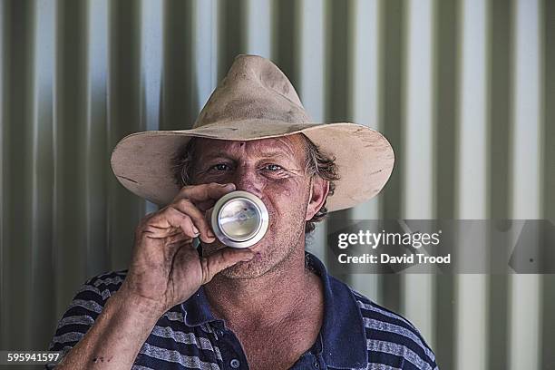 portrait of australian man drinking beer from can - david swallow stock pictures, royalty-free photos & images