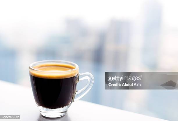 tiny glass cup of espresso coffee - expresso stock pictures, royalty-free photos & images