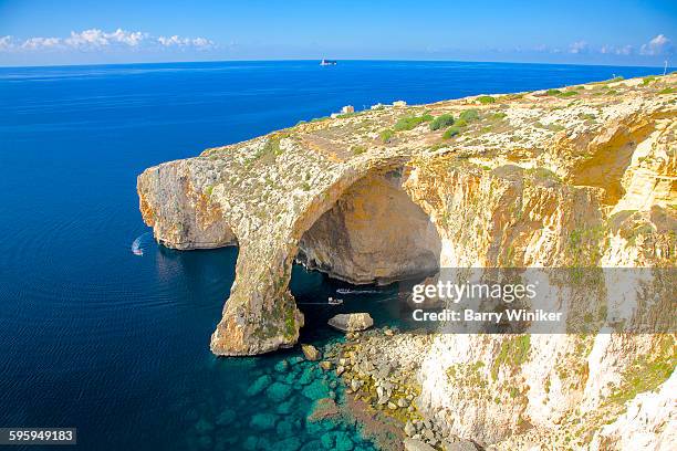 passenger boatss visiting blue grotto, malta - insel malta stock-fotos und bilder