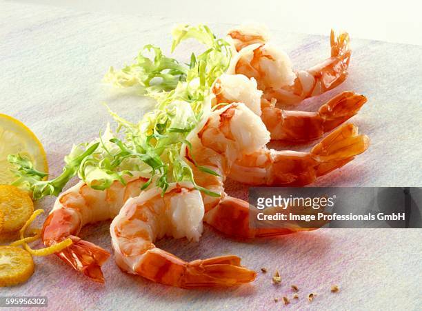 shrimp tails and frisee - curly endive stock pictures, royalty-free photos & images