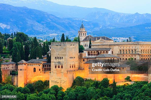 alhambra illuminated at dusk - granada españa stock pictures, royalty-free photos & images