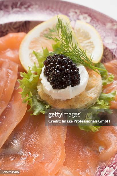 smoked salmon with caviar and sour cream canap?? - canap�� fotografías e imágenes de stock