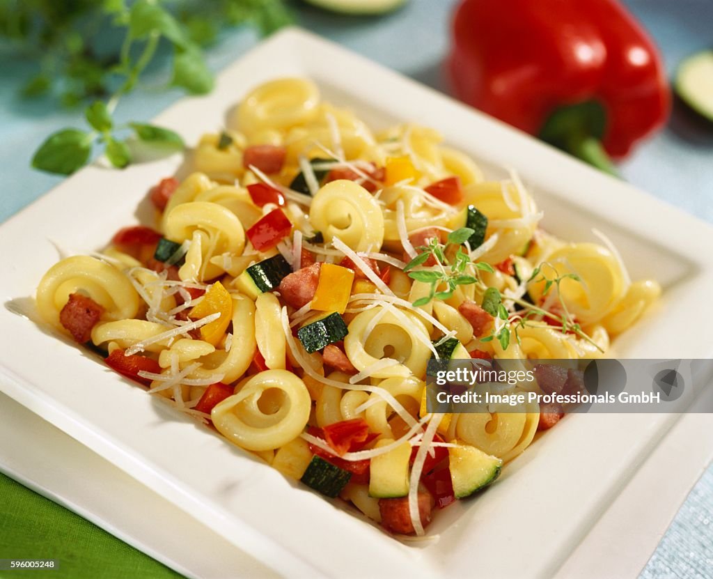 Tortellini with vegetables and diced bacon