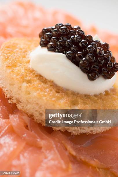 smoked salmon with caviar and sour cream canap?? - canap�� stock-fotos und bilder