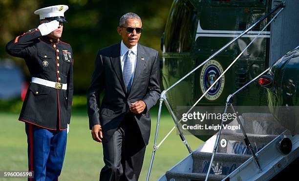 President Obama departs Marine One and walks toward the Oval Office after visiting wounded service members at Walter Reed National Military Medical...