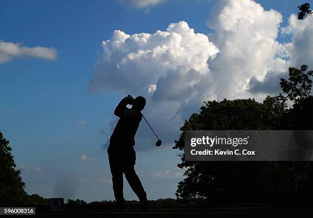 Patrick Reed hits his tee shot on the 17th hole during the second round of The Barclays in the PGA Tour FedExCup Play-Offs on the Black Course at...