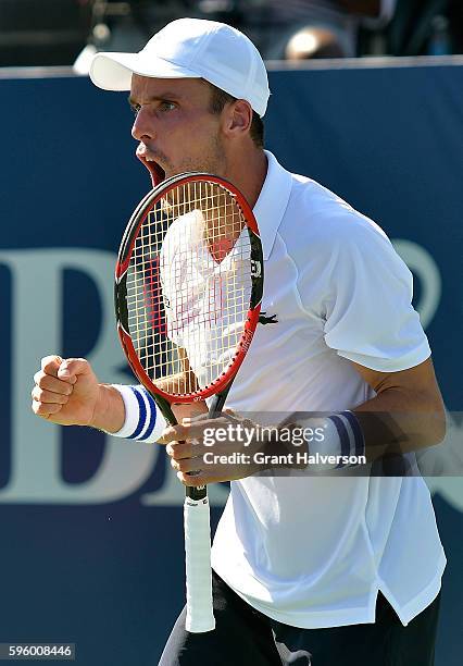 Roberto Bautista Agut of Spain reacts during his win over Viktor Troicki of Russia in the semifinals of the Winston-Salem Open at Wake Forest...
