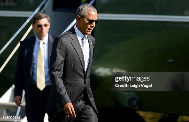 President Obama departs Marine One and walks toward the Oval Office after visiting wounded service members at Walter Reed National Military Medical...