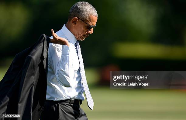 President Obama departs Marine One and walks toward the Oval Office after visiting wounded service members at Walter Reed National Military Medical...