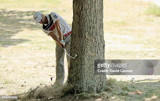 Adam Hadwin of Canada plays his second shot from behind a big tree and bends his club's shaft on teh par 4, fifth hole during the second round of The...