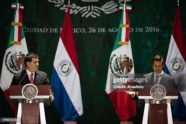 President of Paraguay Horacio Cartes Jara and President of Mexico Enrique Pena Nieto hold a press conference after their meeting at Palacio Nacional...