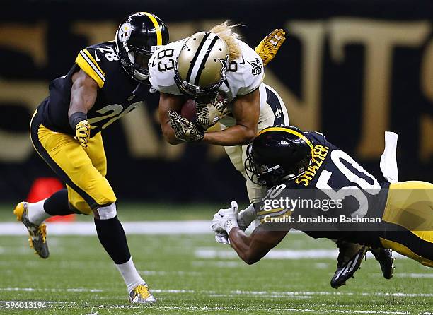Willie Snead of the New Orleans Saints is tackled by Ryan Shazier of the Pittsburgh Steelers and Cortez Allen during the first half of a game at the...