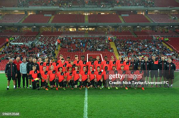 The U18 players pose for a team photo at the end of their training session at Anfield with the new Main Stand in the background on August 26, 2016 in...