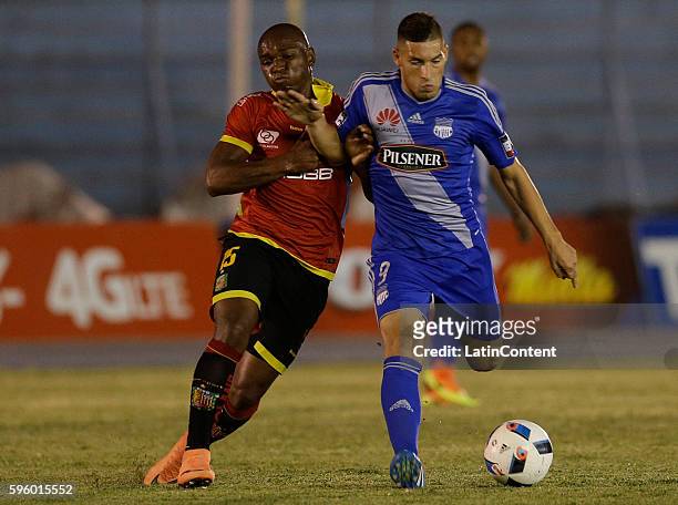 Cristian Guanca of Emelec fights for the ball with Marco Mosquera of Deportivo Cuenca during a match between Emelec and Deportivo Cuenca as part of...