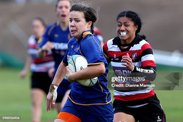 Michaela Baker of Otago makes a break during the round four Farah Palmer Cup match between Otago and Counties Manukau at University Oval on August...